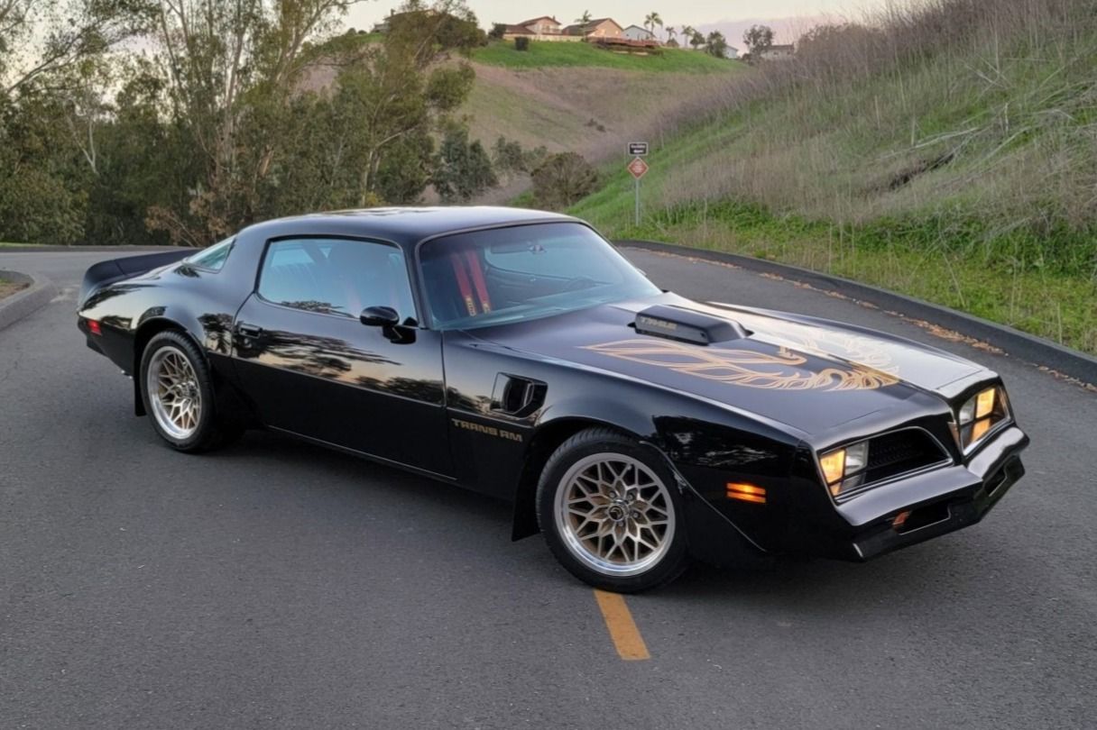 A parked but running 1978 Pontiac Firebird Trans Am