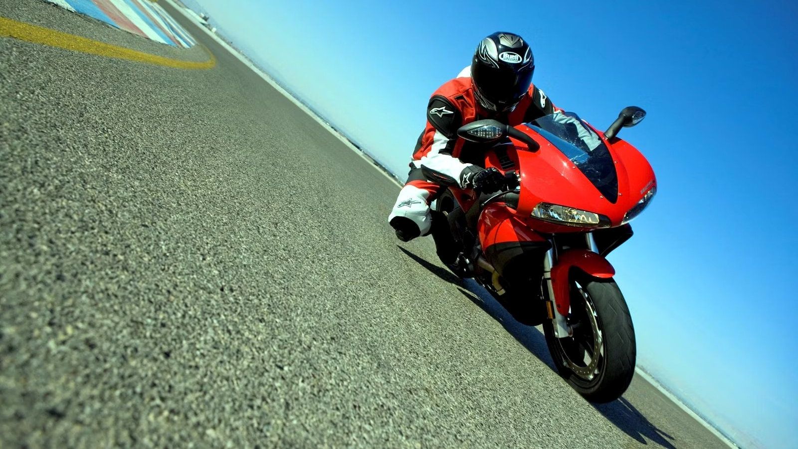 Red 2009 Buell 1125R leaning into a curve