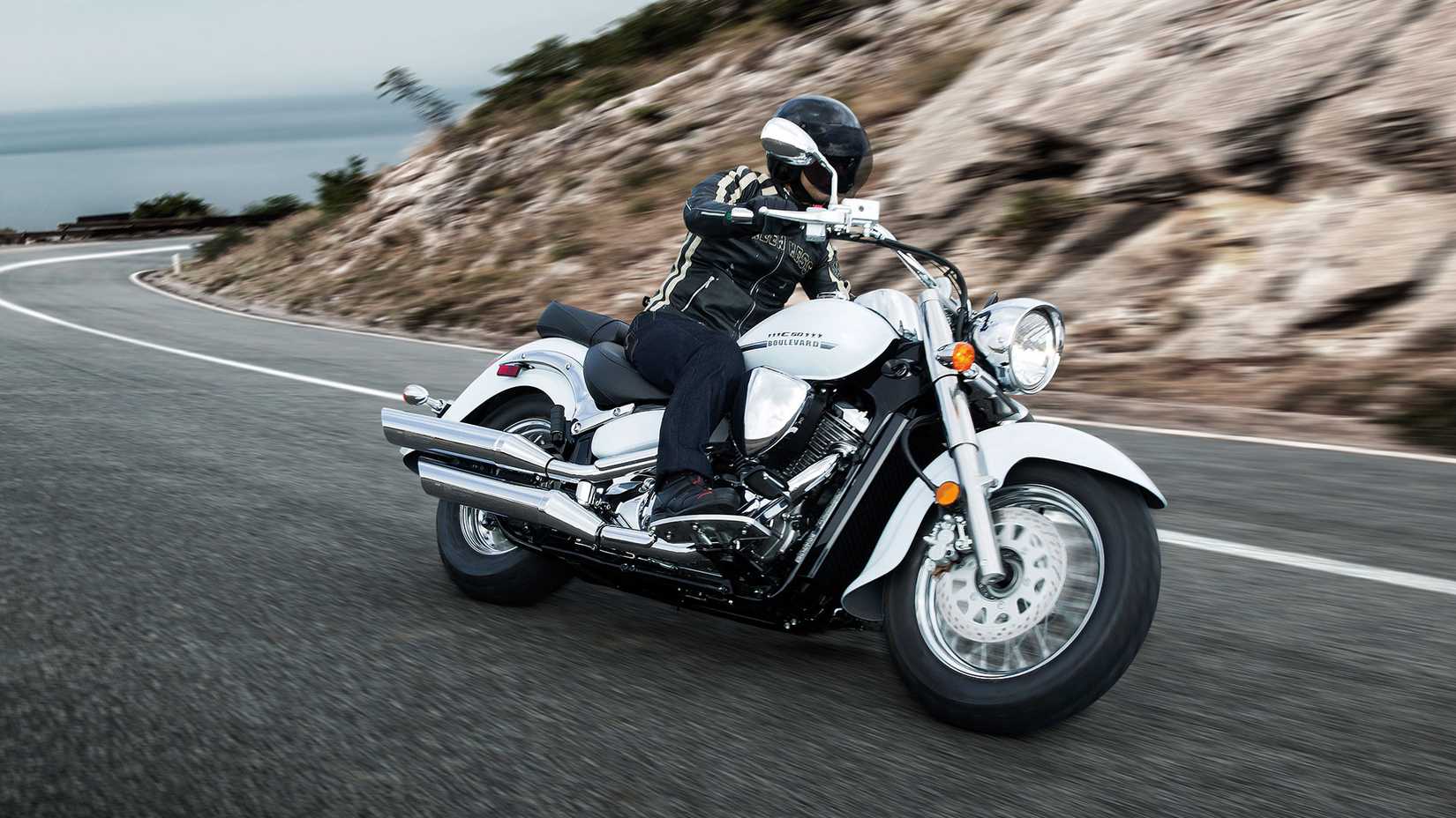 White Suzuki Boulevard C50 leaning into a curve