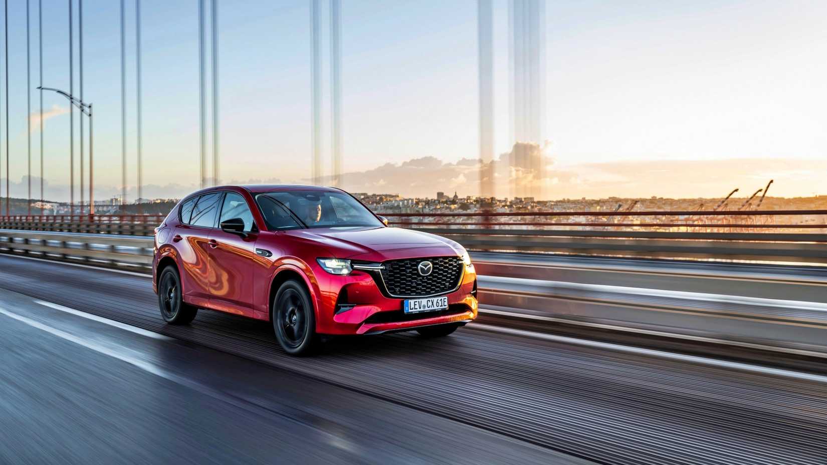 Red Mazda CX-60 driving