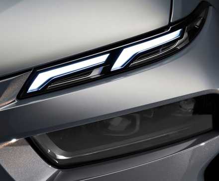 A right front side of a black BMW X7 2023