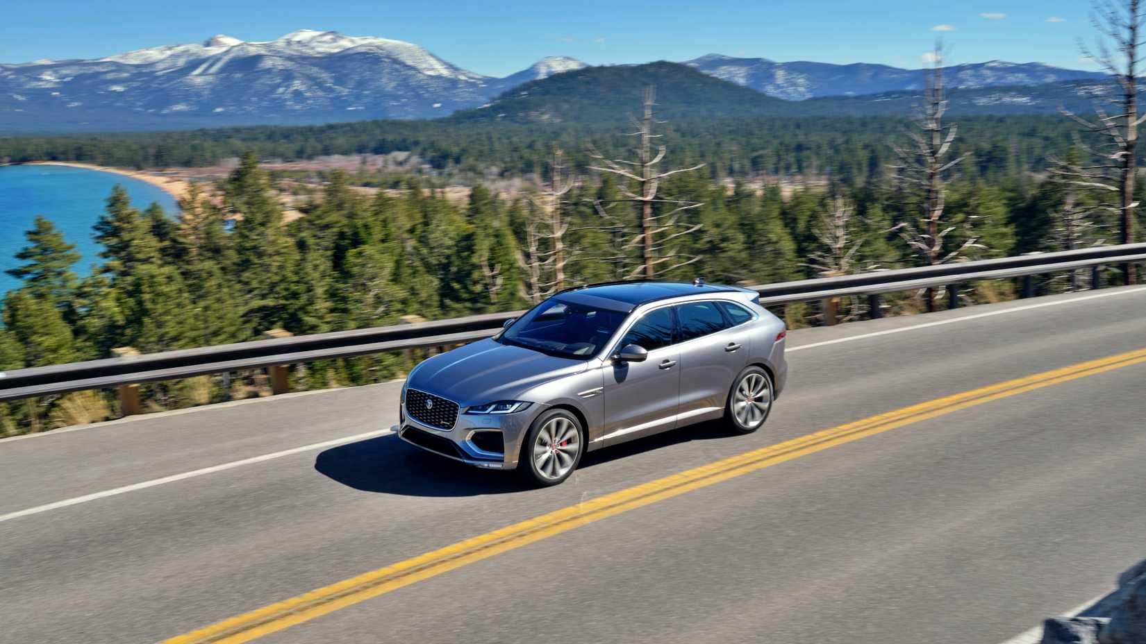 Silver Jaguar F-Pace Driving On A Mountain Road