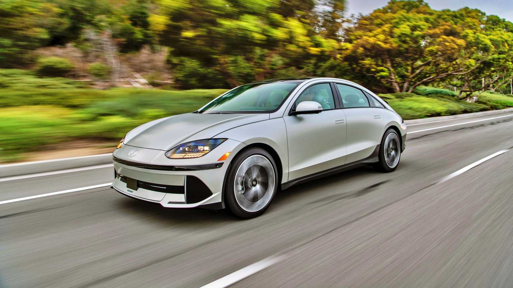 Silver Hyundai Ioniq 6 front 3/4 shot driving on the road