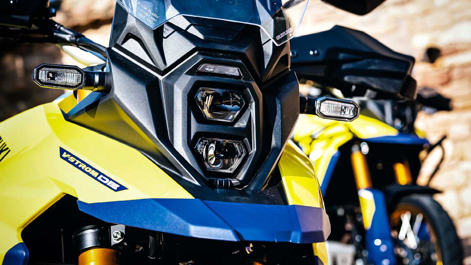 Yellow 2023 Suzuki V-Strom 800DE headlight detail