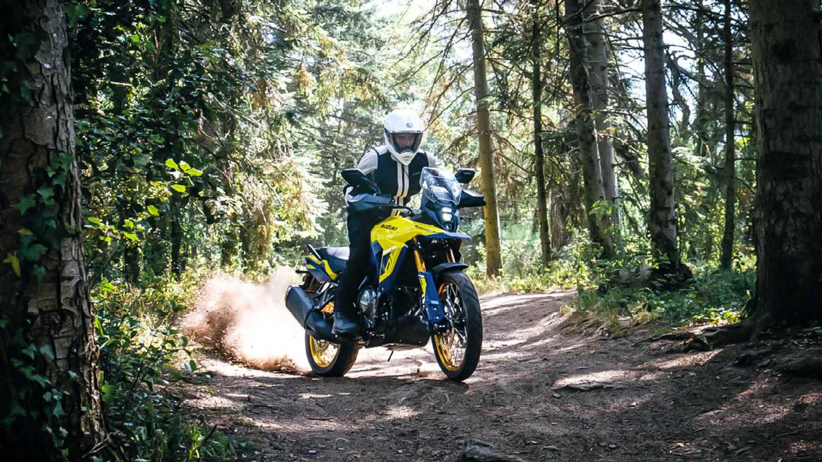 Yellow 2023 Suzuki V-Strom 800DE on a dirt road