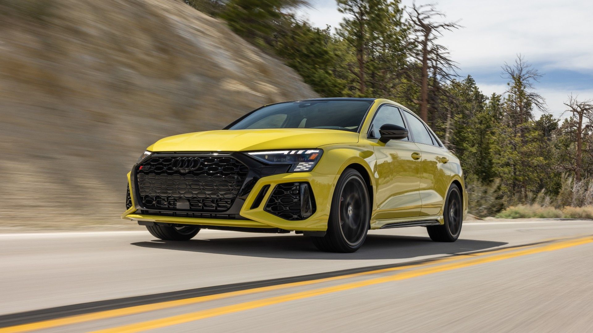 An action shot of an Audi RS3 2022