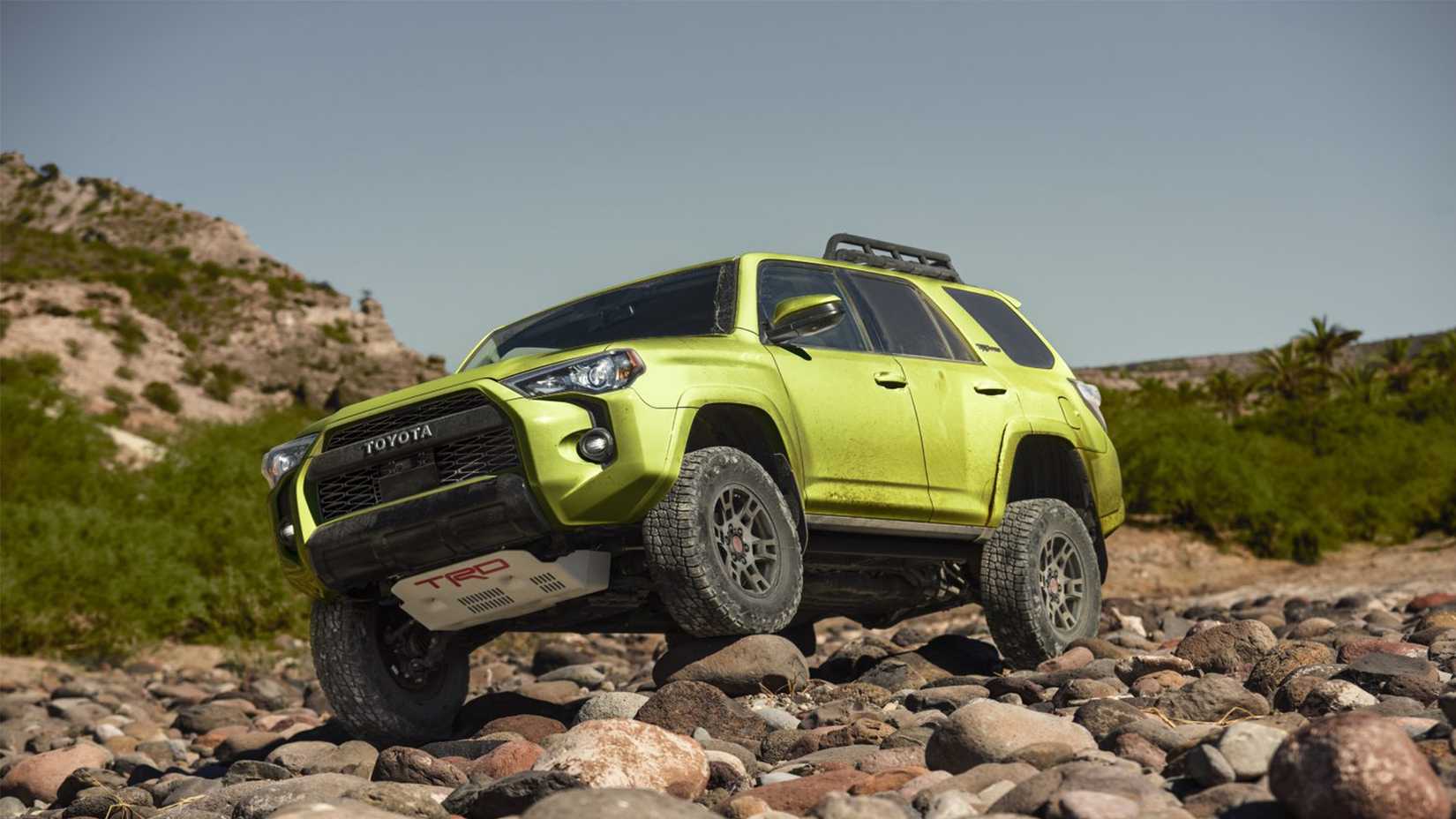 Front 3/4 shot of a green Toyota 4Runner TRD Pro parked on rocks