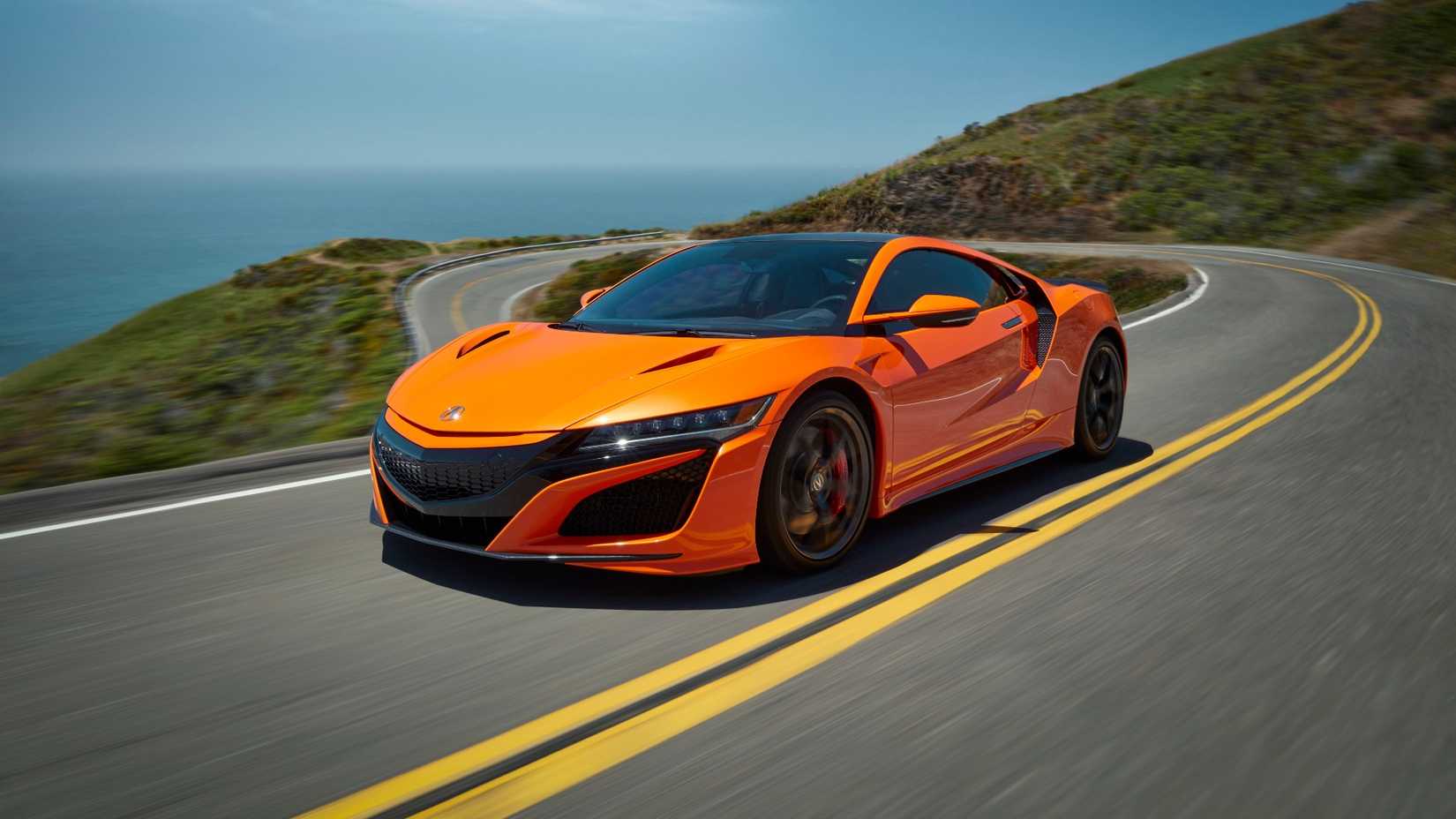 Foto frontal 3/4 de um Acura NSX 2019 em cruzeiro