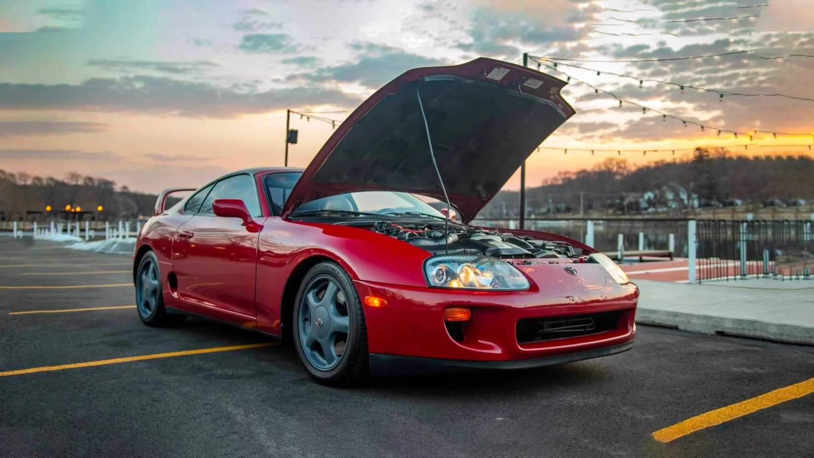 Red 1997 Toyota Supra Turbo with the hood open