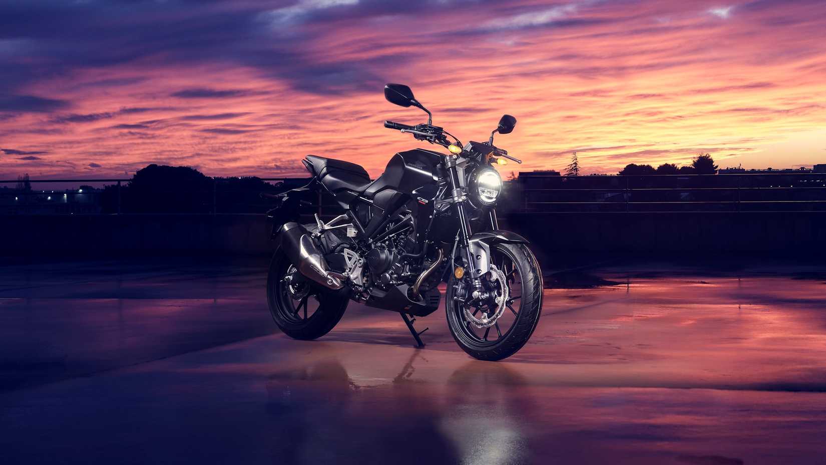 Black 2022 Honda CB300R against an evening sky
