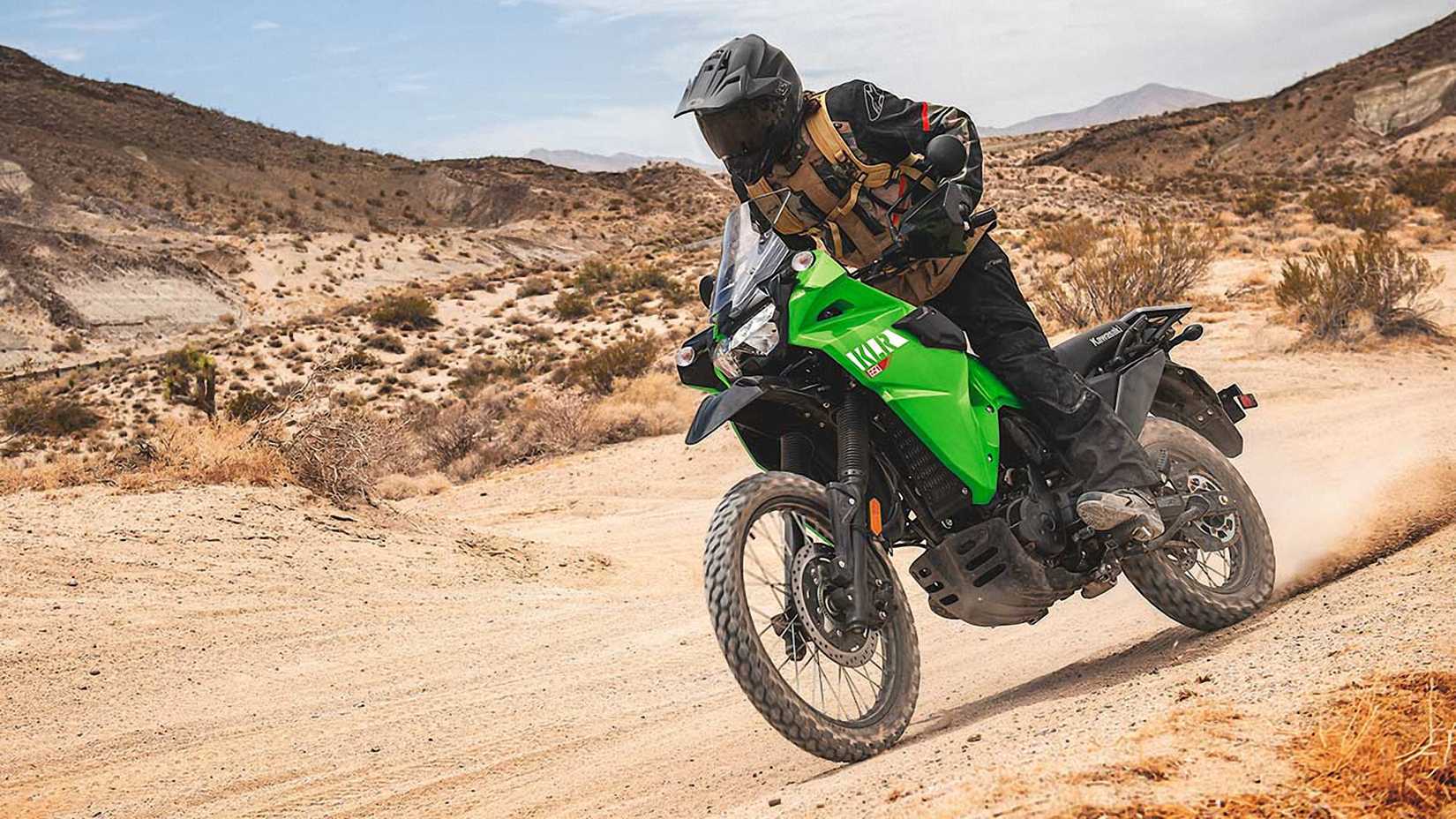 Green 2023 Kawasaki KLR650 on a trail