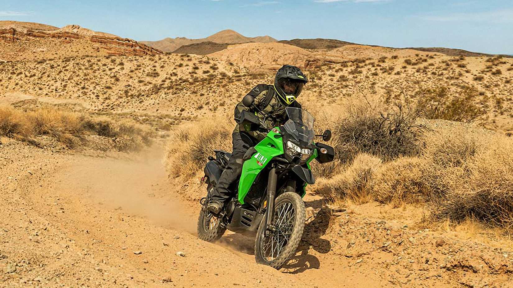 Green 2023 Kawasaki KLR650 S on a trail