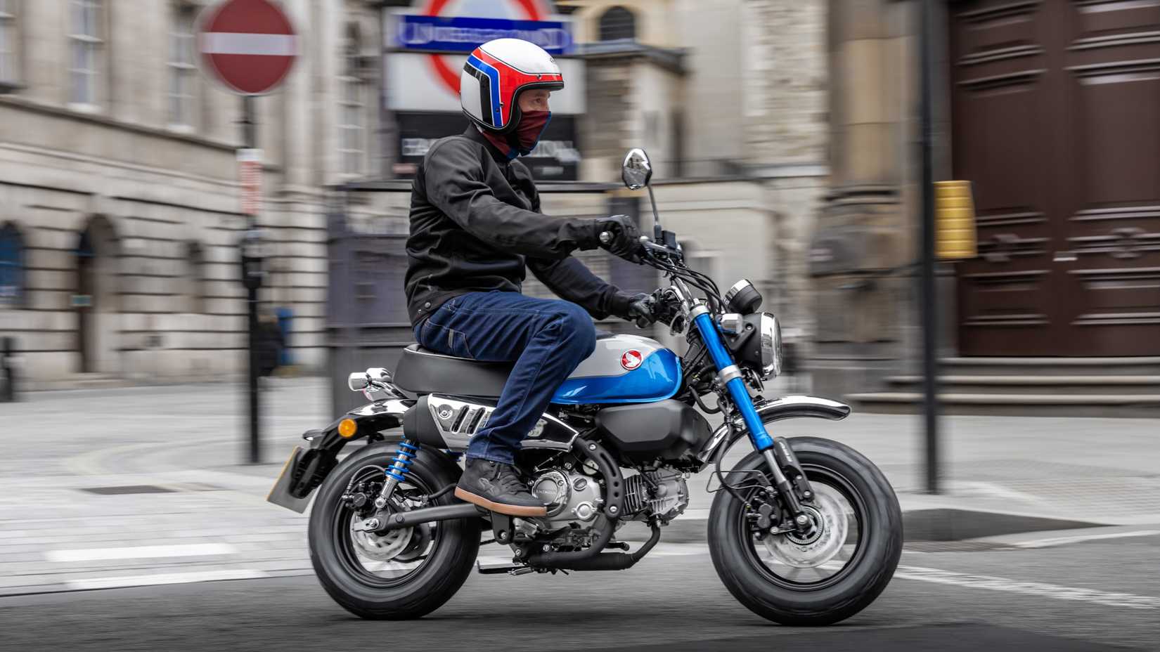 Blue 2021 Honda Monkey cruising through town