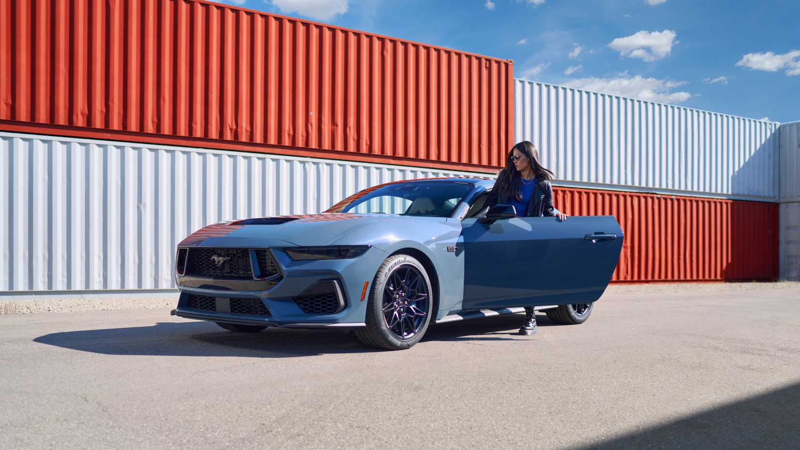 A shot of a woman entering the 2024 Ford Mustang EcoBoost Fastback