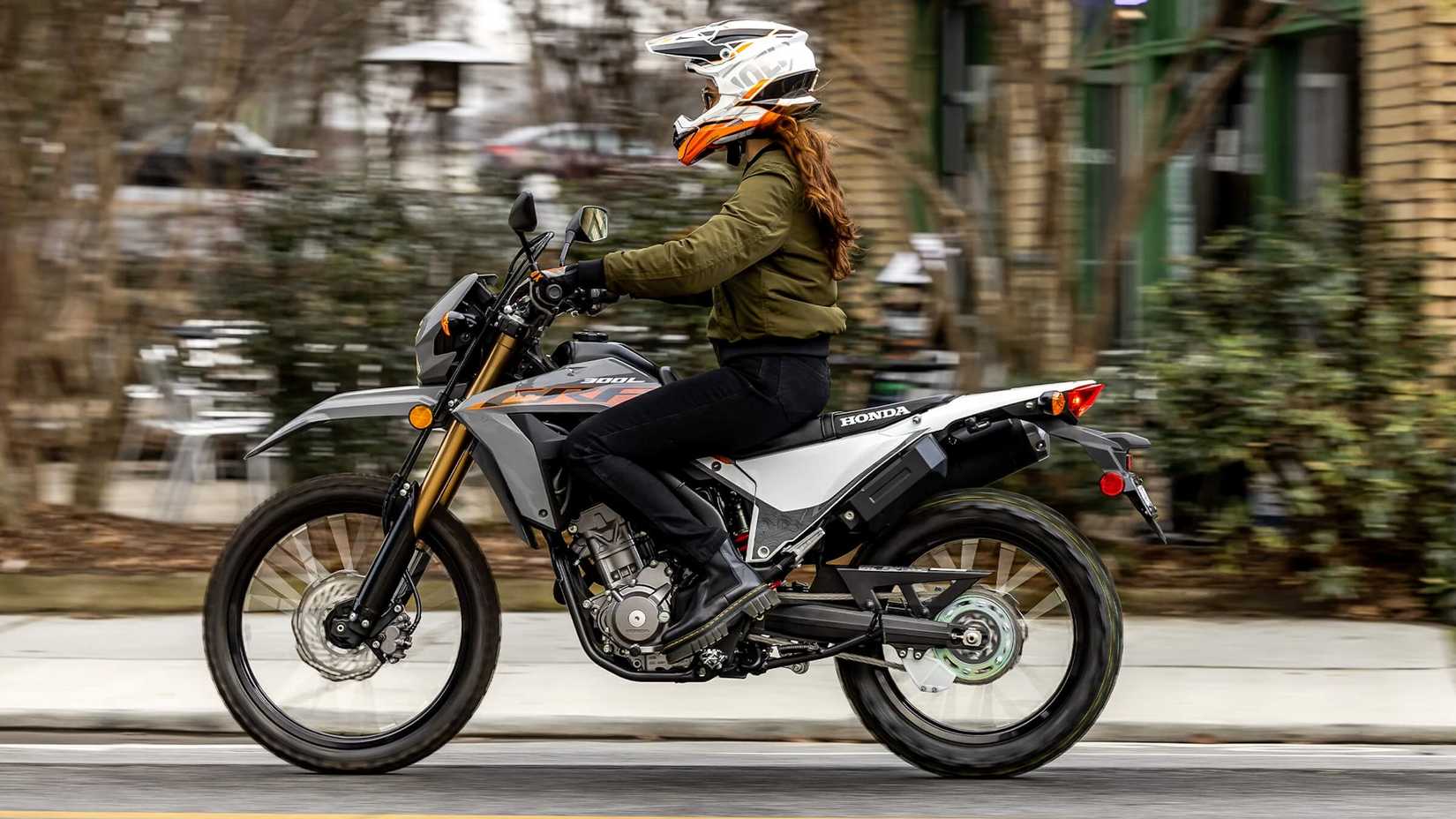 Gray 2023 Honda CRF300LS cruising through town