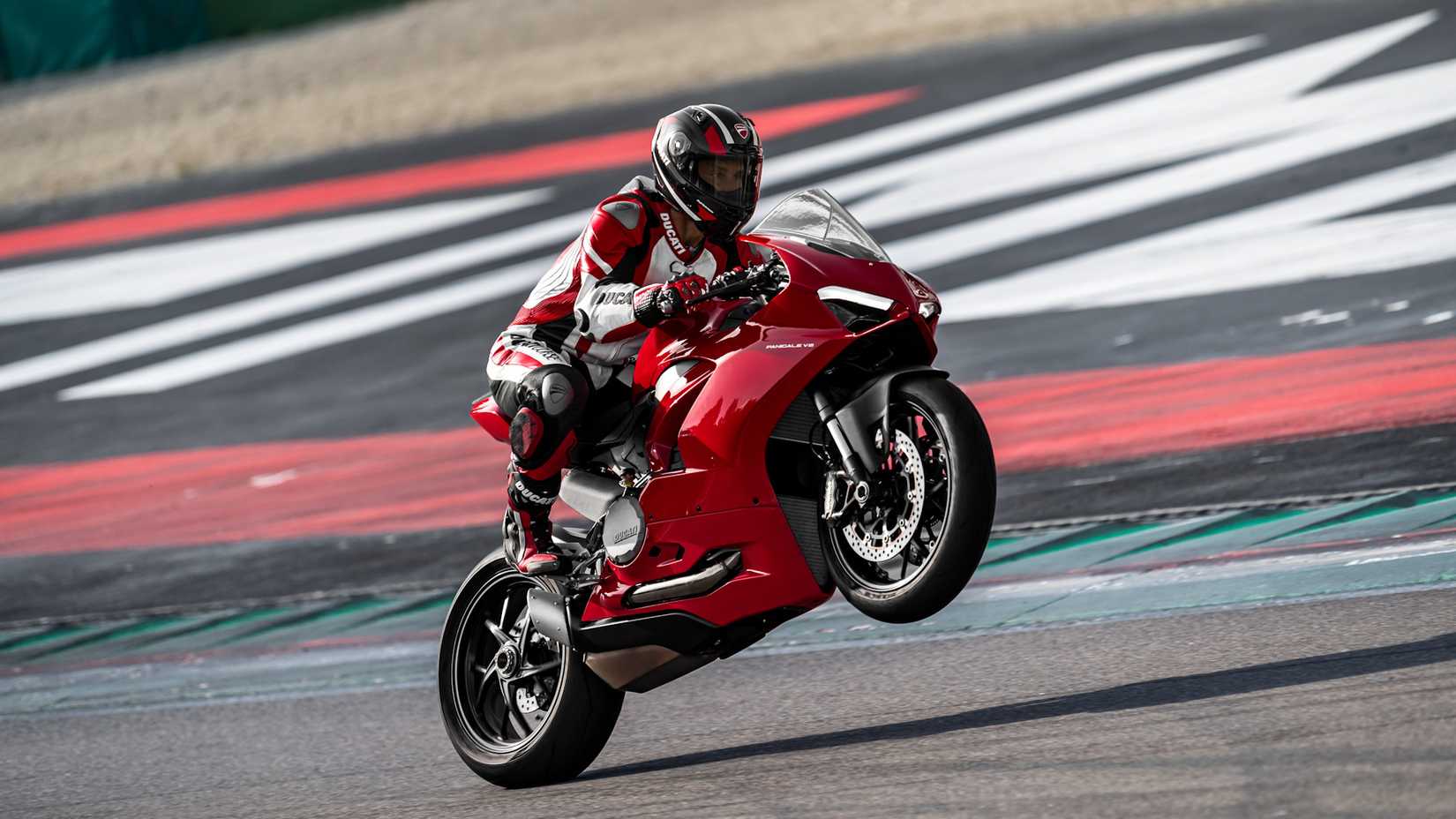Red 2020 Ducati Panigale V2 popping a wheelie