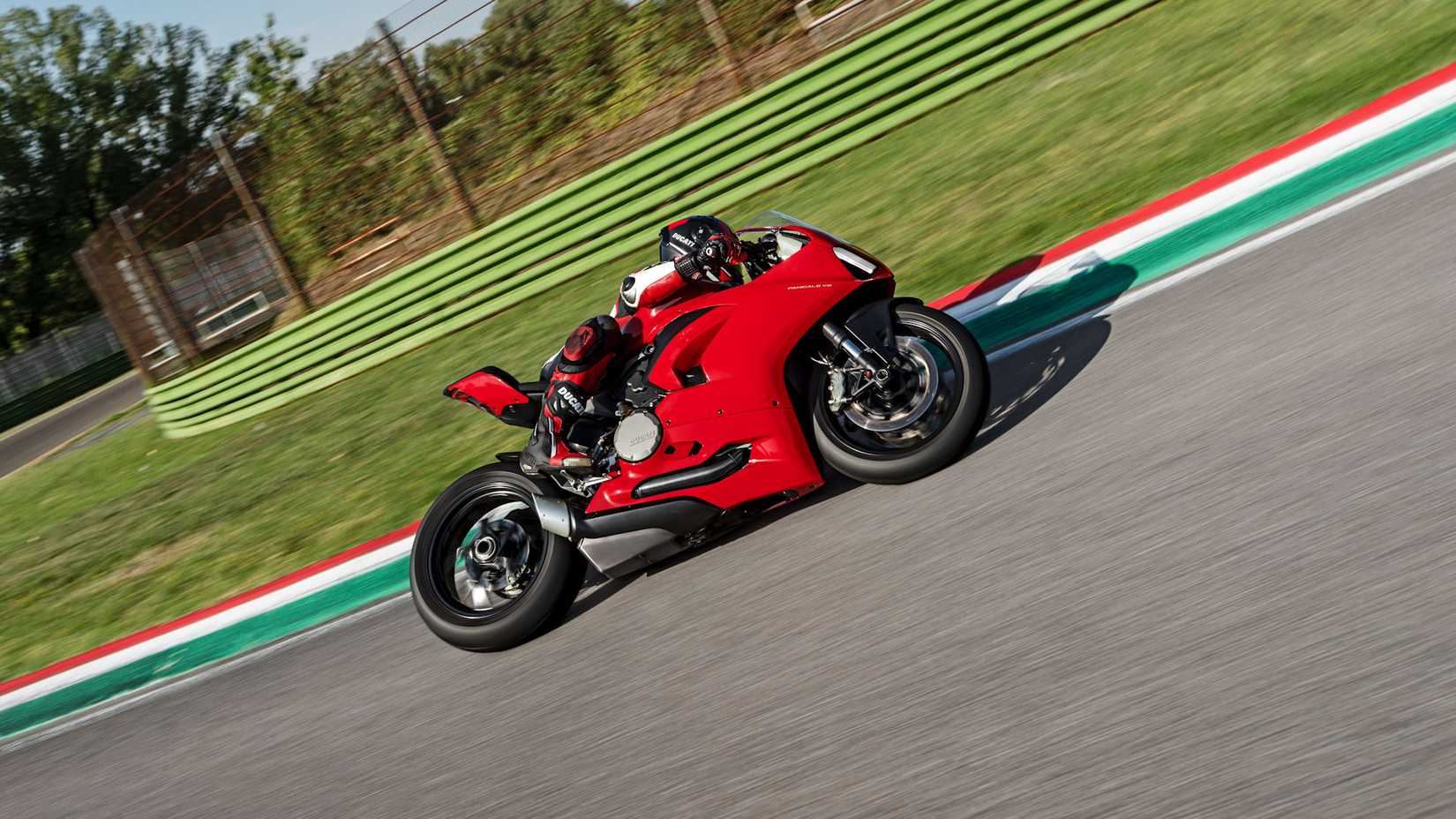 Red 2020 Ducati Panigale V2 taking a curve 