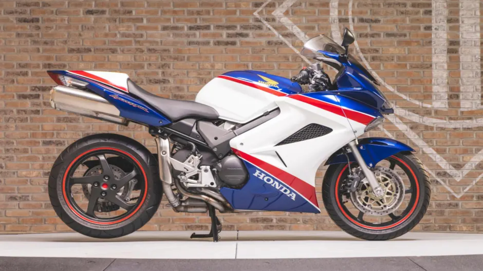 Blue and white Honda VFR800 on display