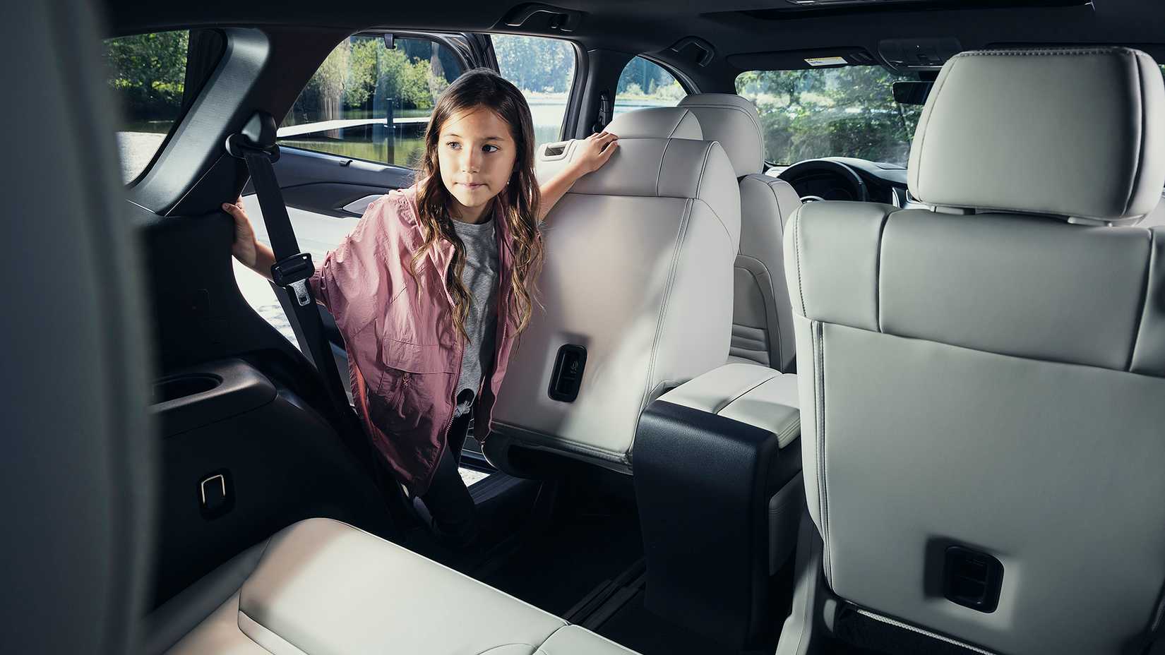 A child entering the third row of the 2023 Mazda CX-9 Signature