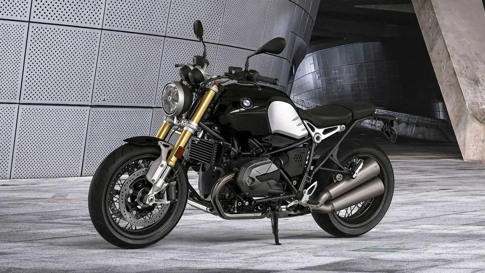 A black 2021 BMW R nineT parked under a bridge