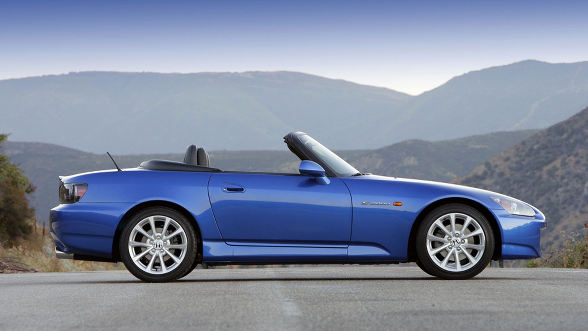 Blue Honda S2000 side right exterior shot
