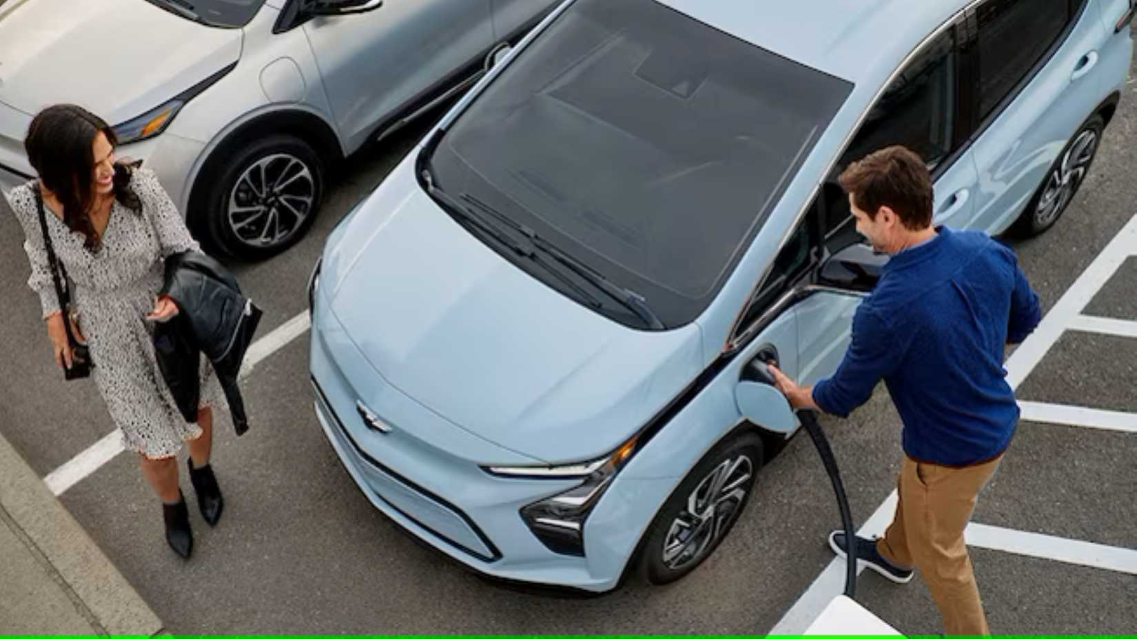 Top shot of a 2022 Chevy Bolt at a charging station.