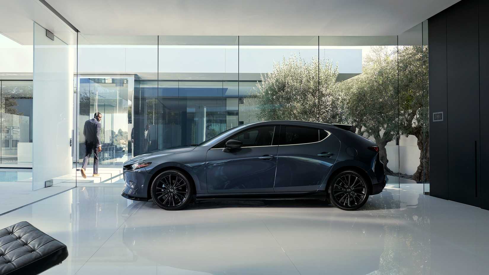 Side view of a 2021 Mazda 3 Turbo parked at dealership