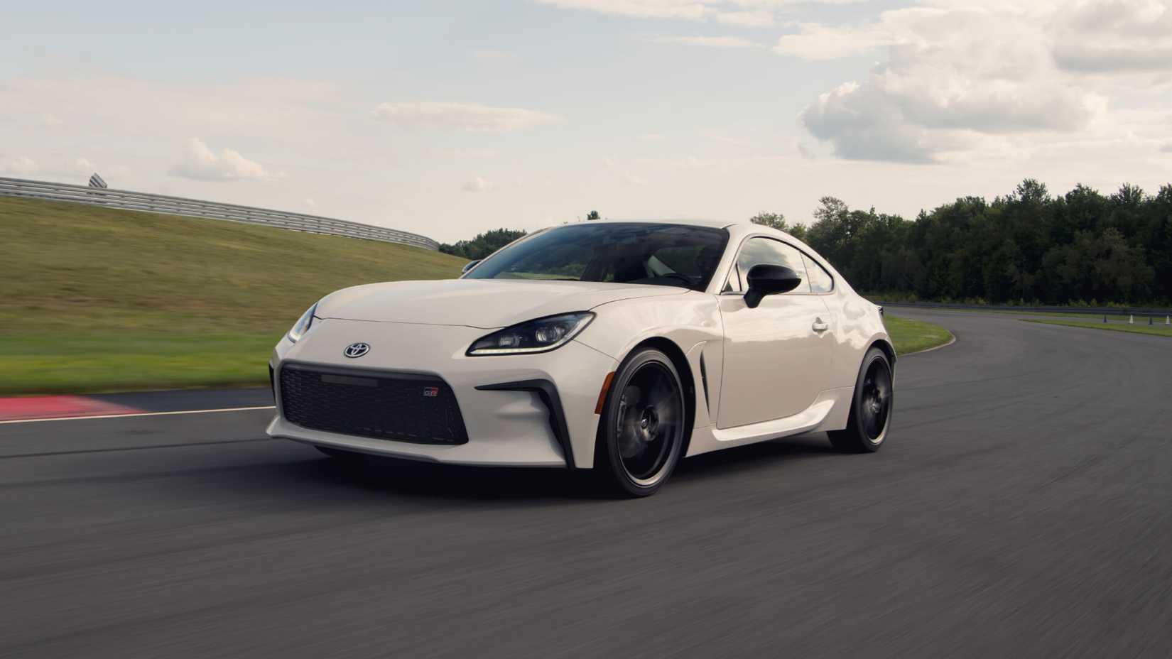 Front 3/4 of the Toyota GR86 driving fast on a racetrack