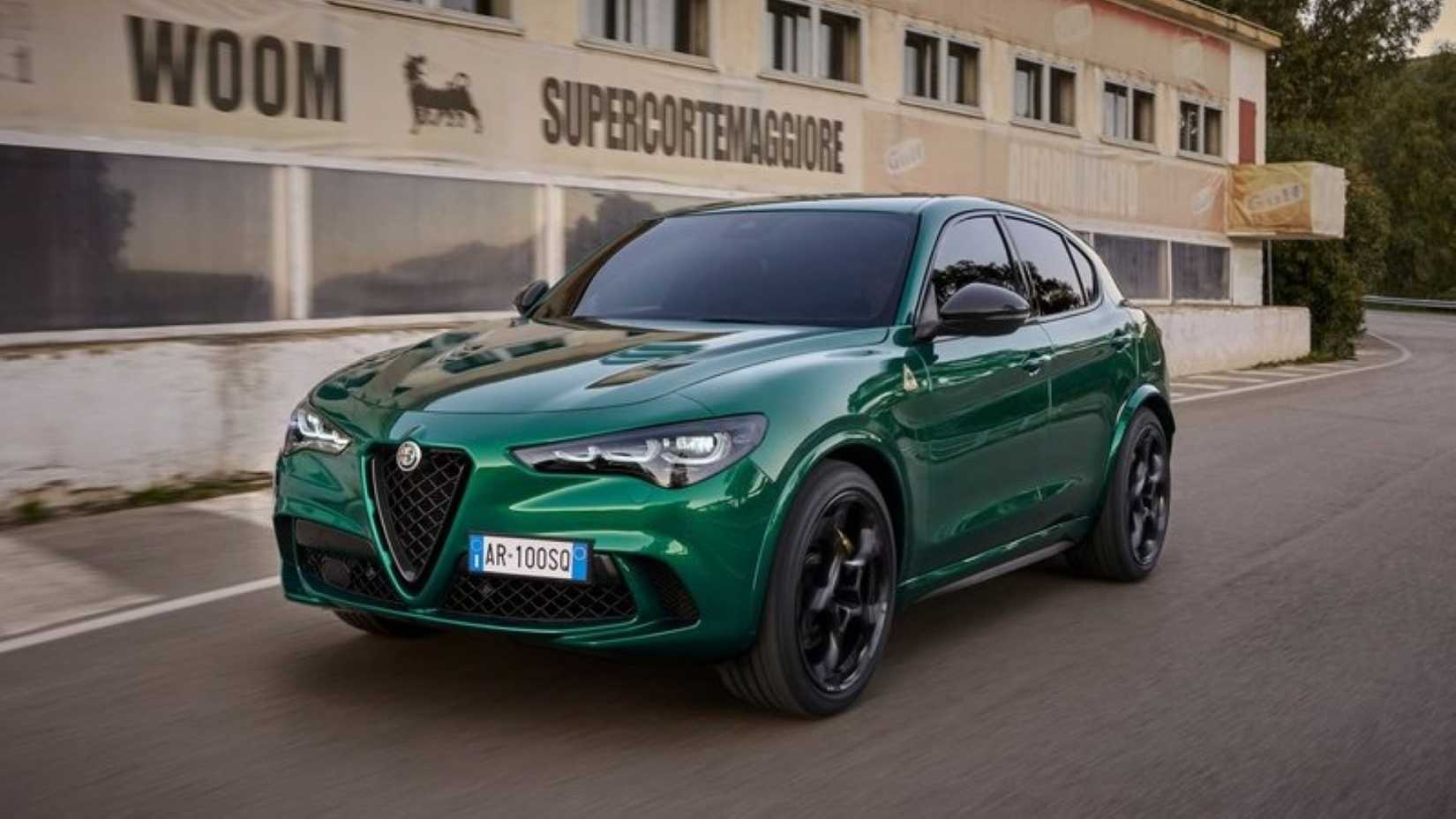 A front 3/4 shot of a 2023 Alfa Romeo Stelvio Quadrifoglio driving on the road