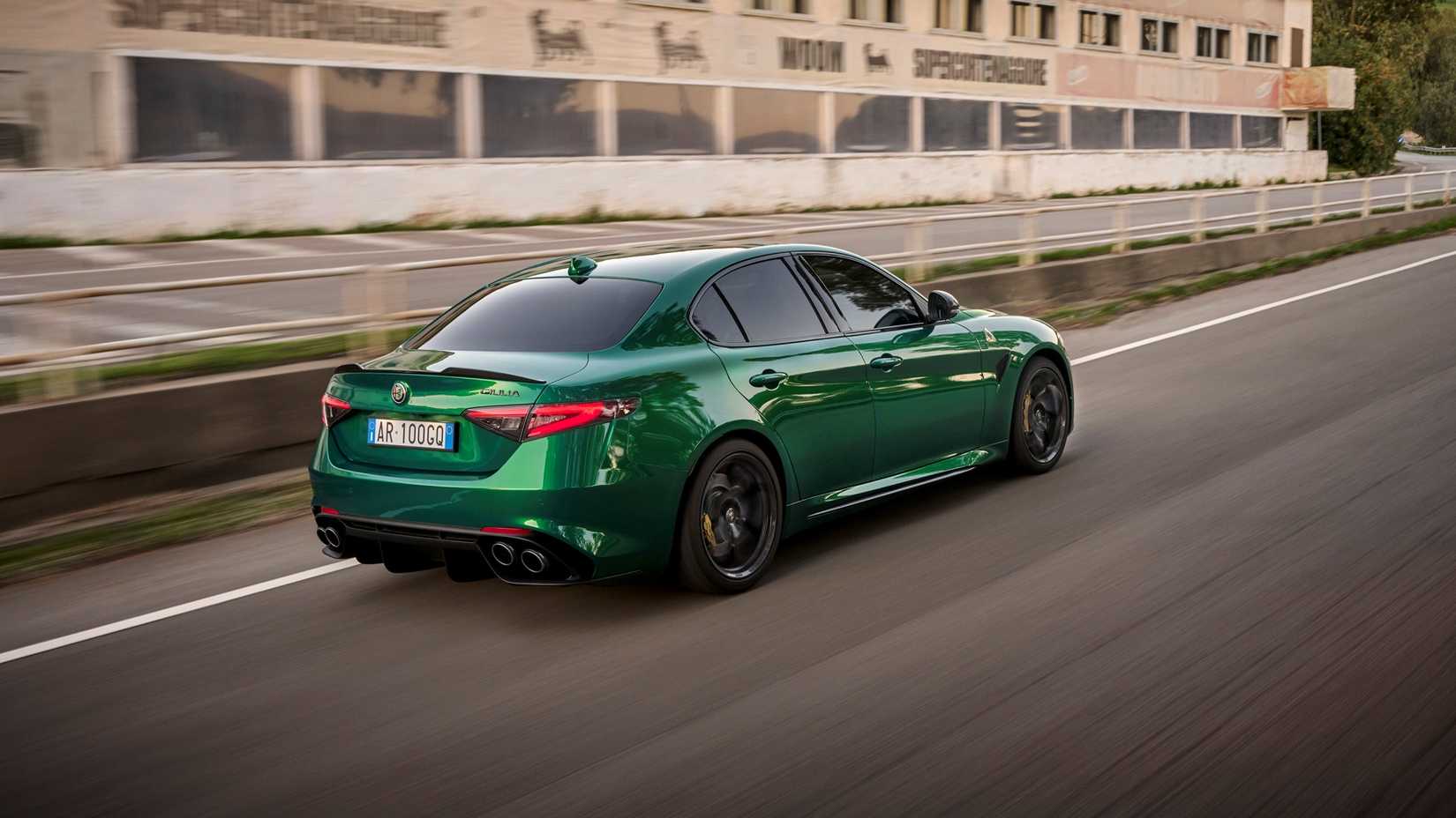 A rear 3/4 action shot of a 2024 Alfa Romeo Giulia Quadrifoglio