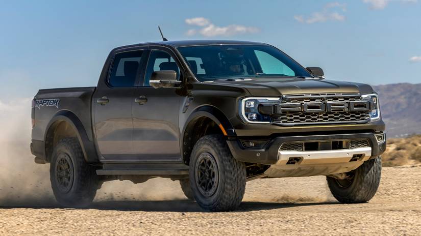Ford Ranger Raptor navigating a rugged off-road trail with precision and power