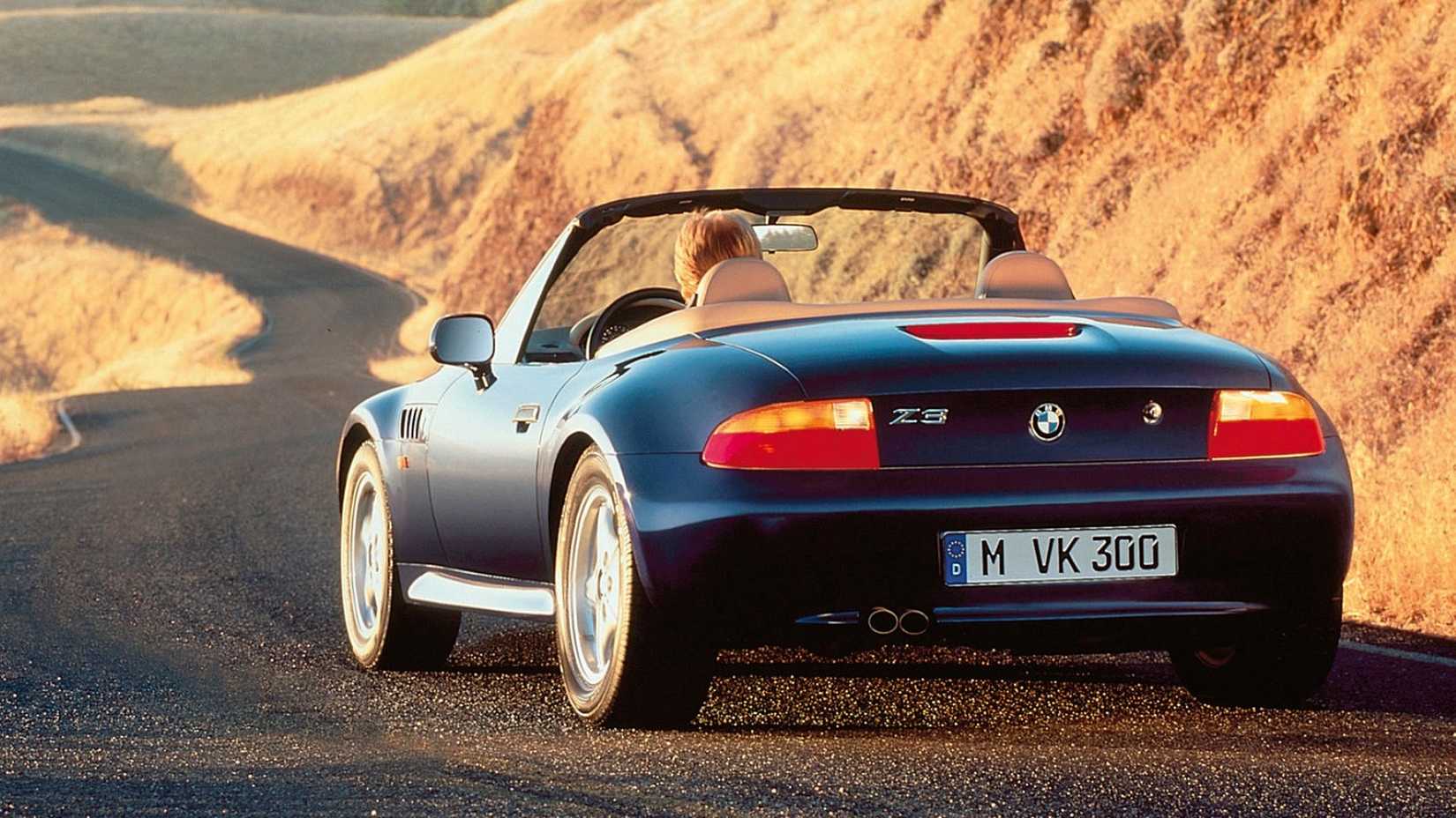 1996 BMW Z3 in blue driving through desert
