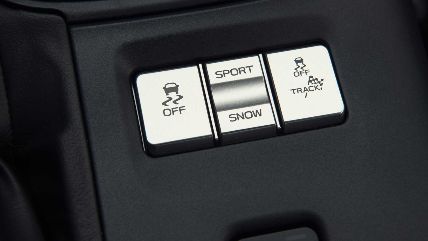 Traction control and track mode buttons of the Toyota GR86 