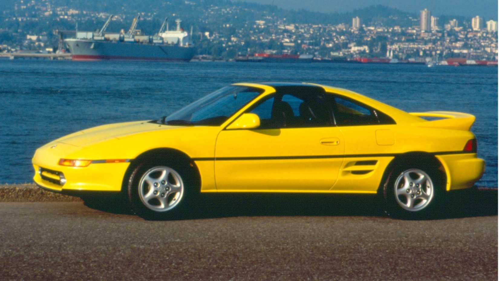 Side shot of a 1992 Toyota MR2 parked at the harbor