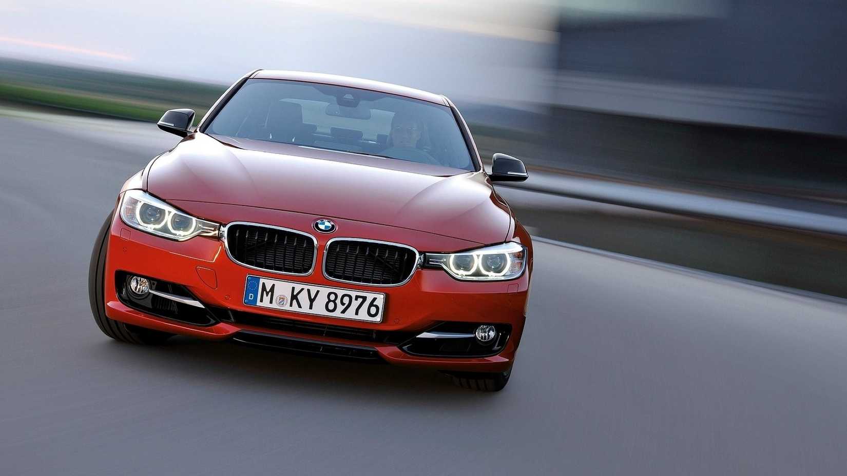 Front shot of a 2012 BMW 3 Series powersliding