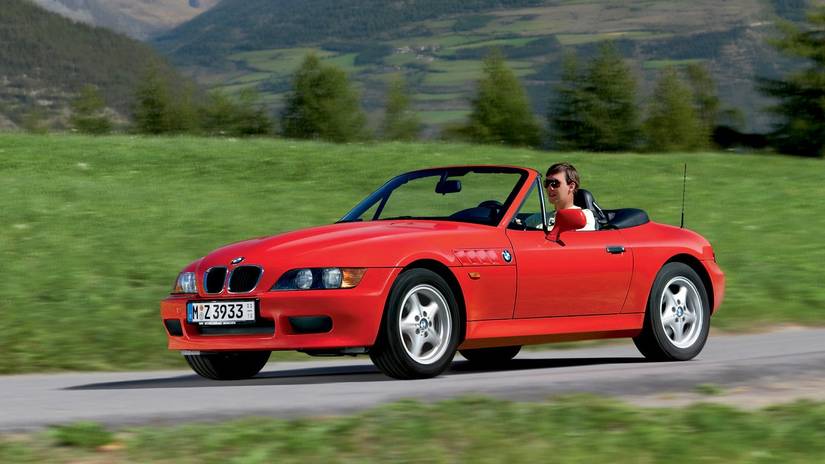 1996 BMW Z3 in red driving along country road