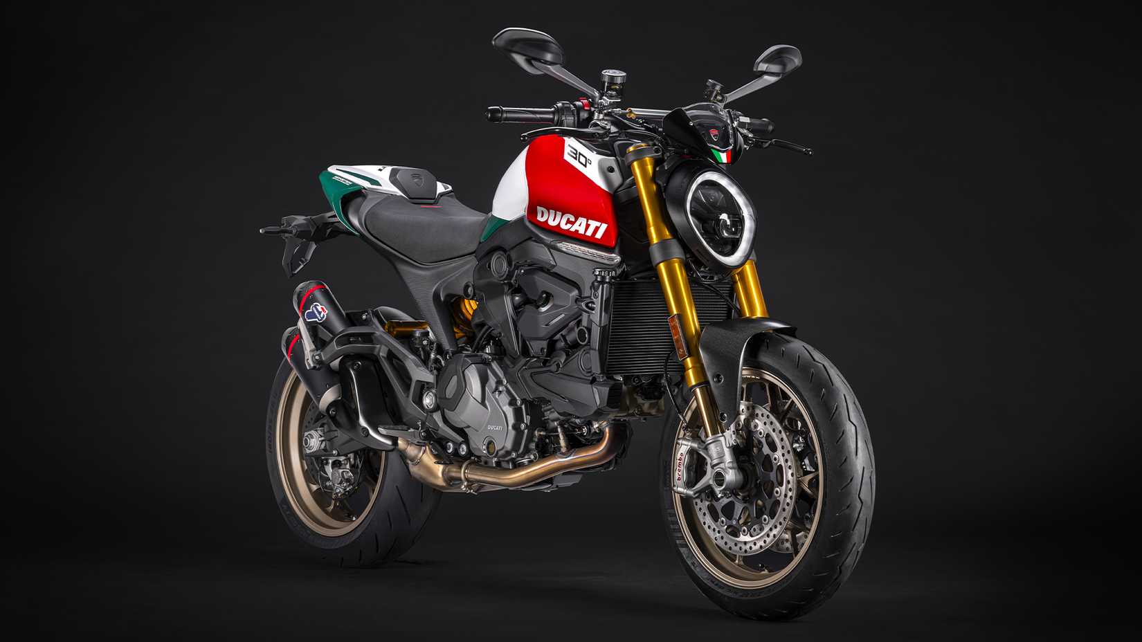 A front 3/4 studio shot of a Ducati Monster 30th Anniversary Edition