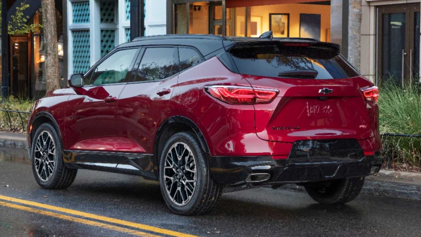 Three quarters rear shot of a red 2023 Chevrolet Blazer on a street.