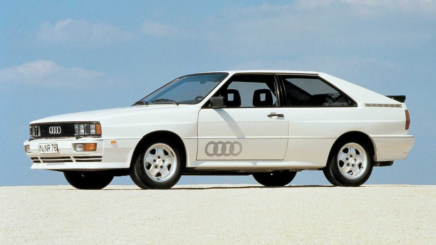 Three-quarter shot of a White 1980 Audi Quattro parked on sand