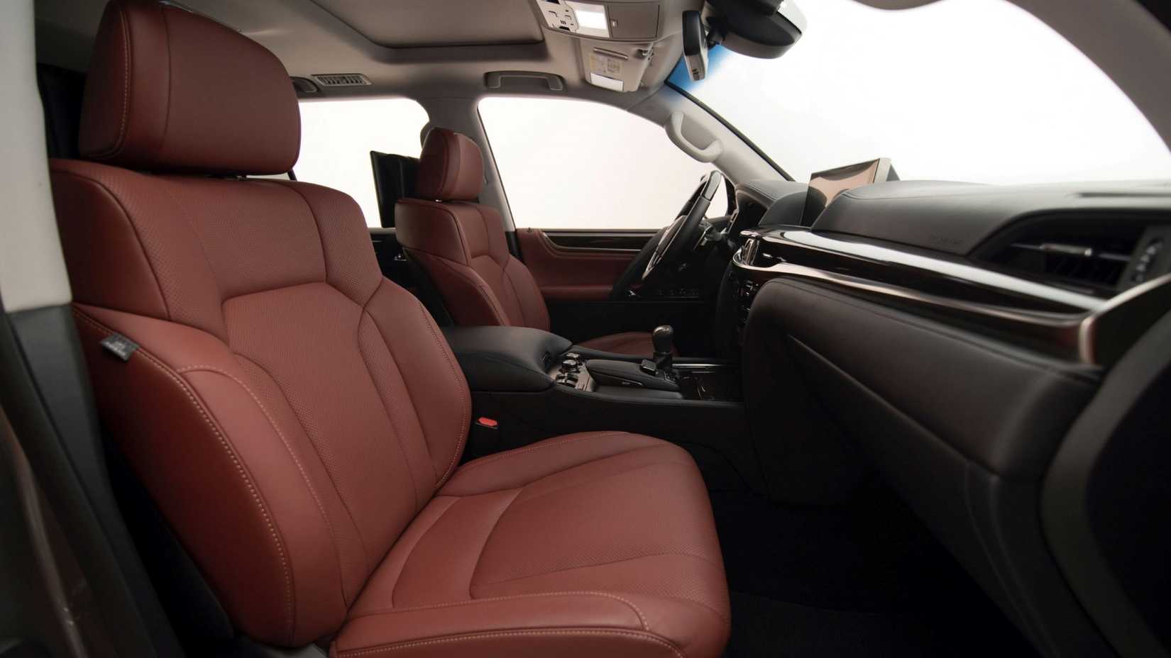 A shot of the fronts seats from outside the passenger door, of a 2021 Lexus LX 570