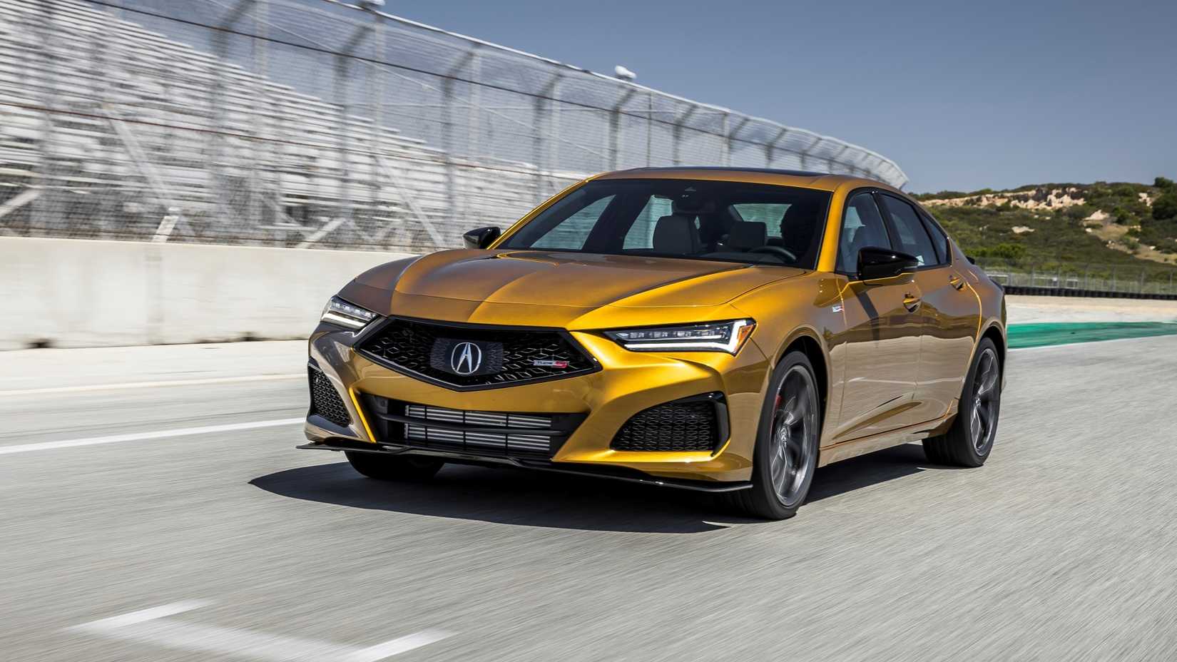 Front 3/4 action shot of the 2023 Acura TLX Type S driving on track