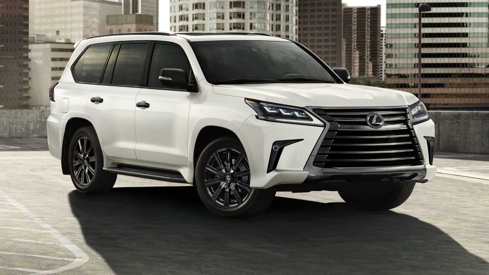 Front 3/4 view of the 2021 Lexus LX 570 parked in a lot