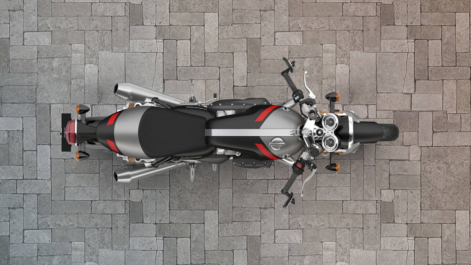 Una Triumph Thruxton RS in curva, con posizione di guida aggressiva e dettagli tecnici distintivi