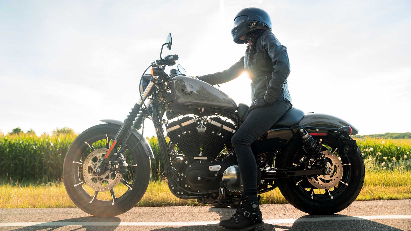 Rider sitting astride a 2022 Harley-Davidson Iron 883