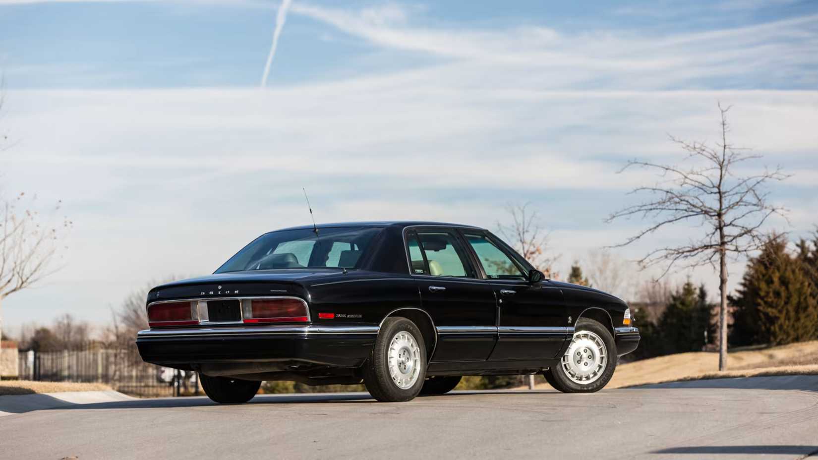 Black 1996 Buick Park Avenue rear 3/4 shot parked