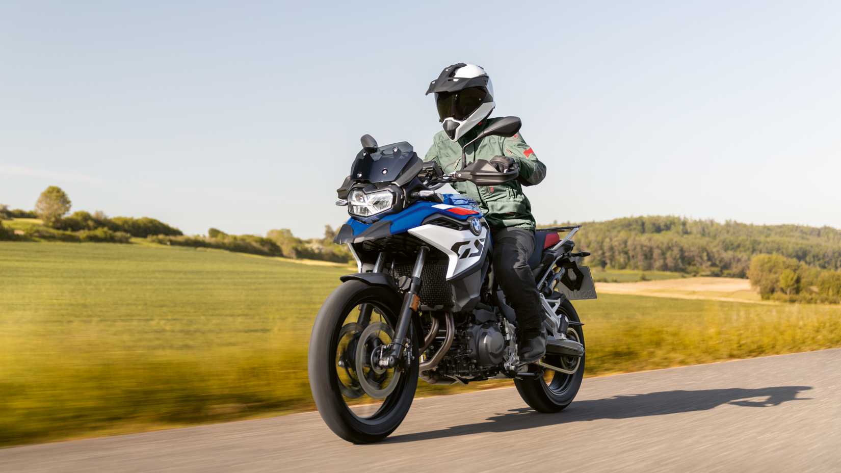 2025 BMW F 800 GS cruising on the road front third quarter view