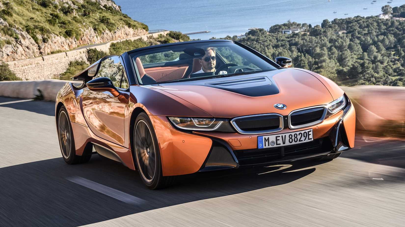 Orange i8 Roadster Driving