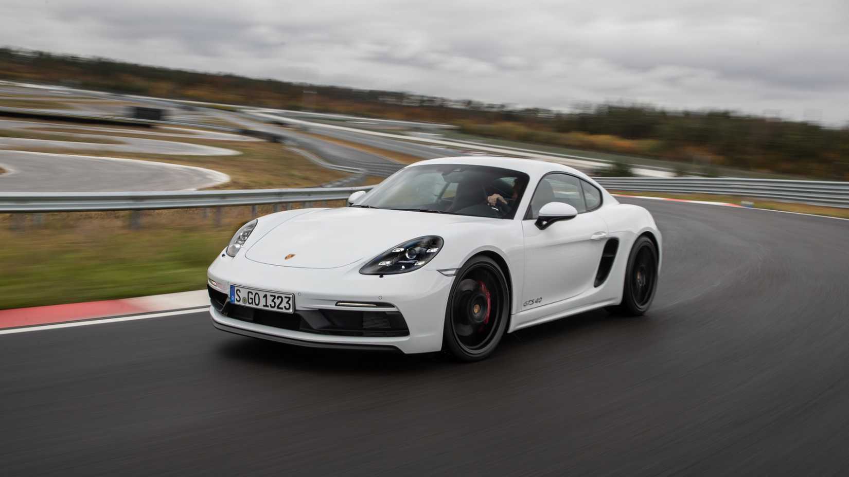 Porsche 718 Cayman GTS 4.0-liter in white posing on track