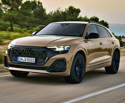 Brown 2023 Audi Q8 front 3/4 action shot