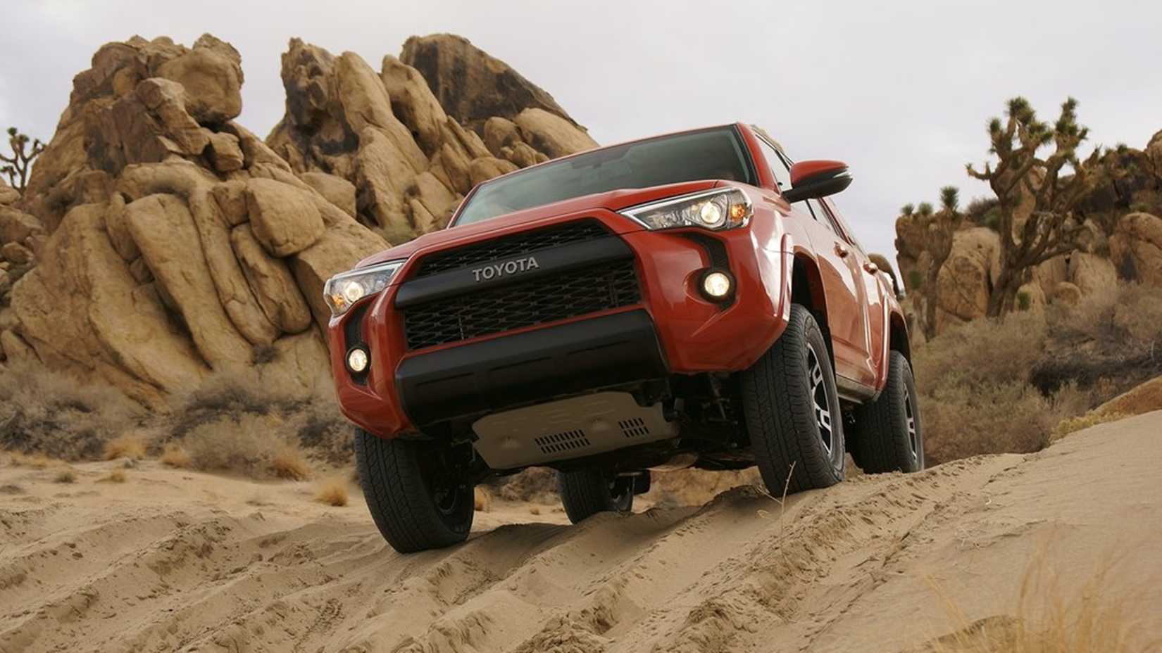 2015 Toyota 4Runner TRD Pro Series in red traversing sandy terrain